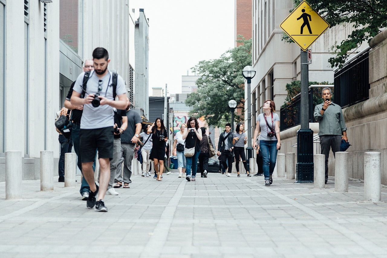 people walking with cameras