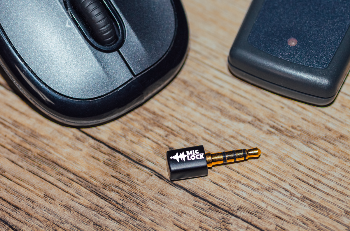 Mic-Lock 3.5 mm Jack on table beside computer mouse
