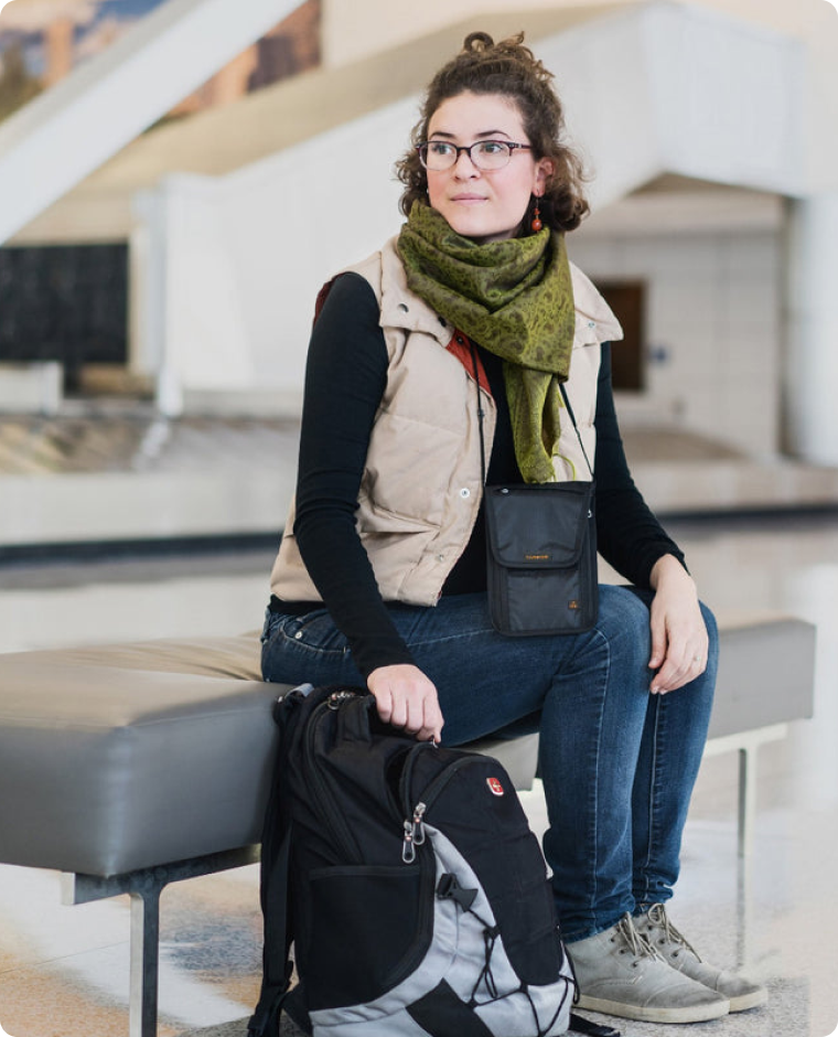 Girl at airport with neck wallet