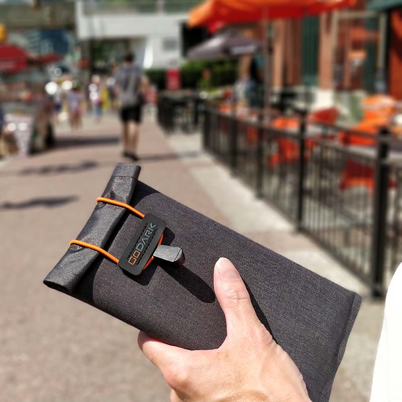 Person holding GoDark Faraday Phone Bag