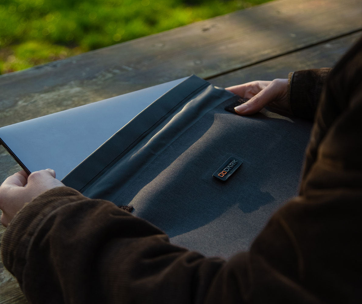 GoDark Laptop Sleeve outside on a table