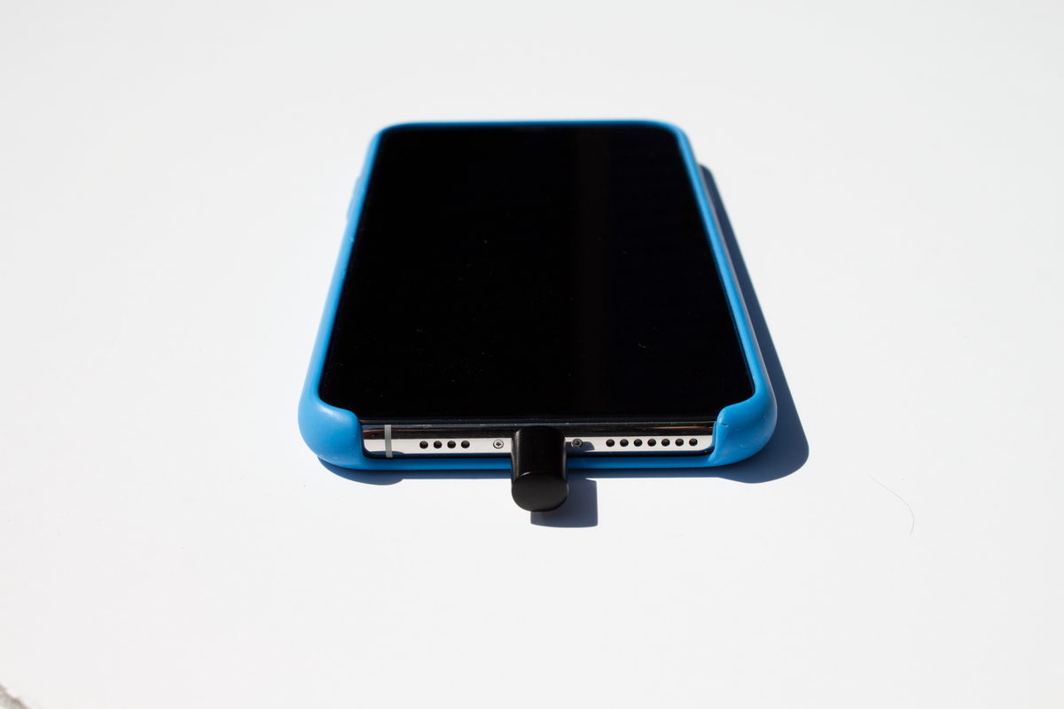 Mic-Lock Lightning plugged into iPhone 