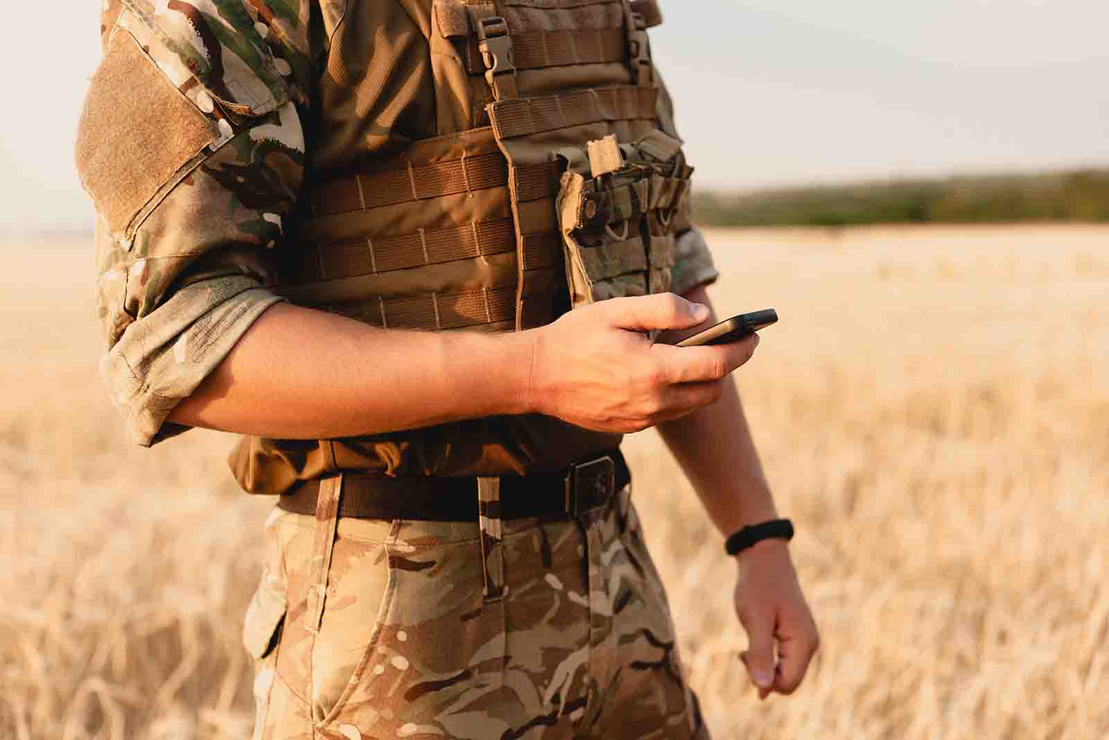 Military person with phone